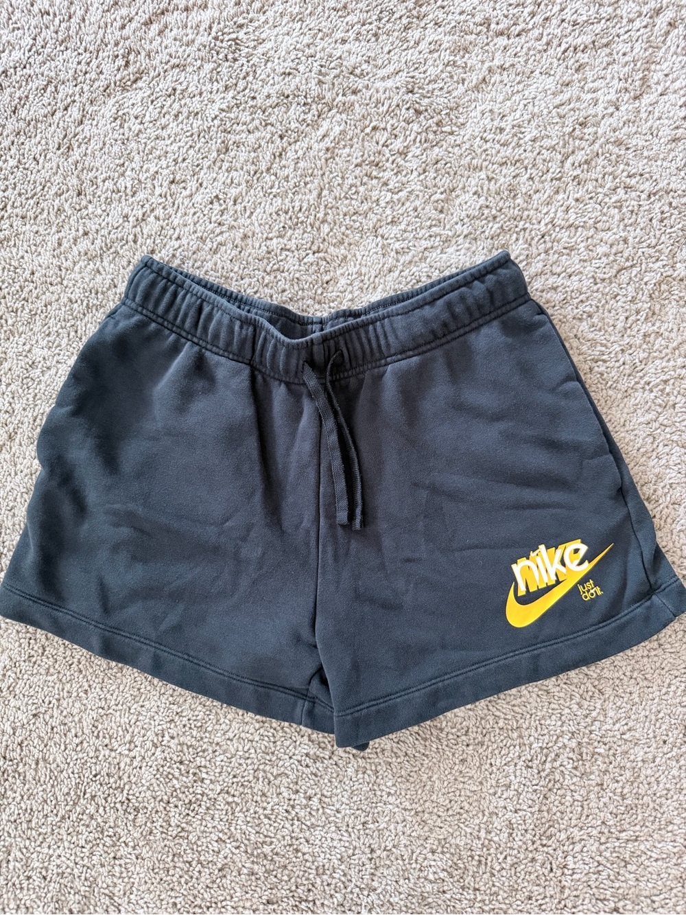 Nike Women's Black Athletic Shorts with Yellow Swoosh